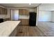 Cozy kitchen features wood cabinets and modern appliances at 493 Eagle Mills Rd, Hamptonville, NC 27020