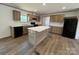 Well-equipped kitchen features wood cabinets, modern appliances, and a center island at 493 Eagle Mills Rd, Hamptonville, NC 27020