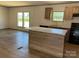 Spacious kitchen features a center island and black appliances at 493 Eagle Mills Rd, Hamptonville, NC 27020