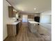 Bright kitchen with wood cabinets and stainless steel appliances at 493 Eagle Mills Rd, Hamptonville, NC 27020