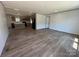 Open-concept living room features wood-look floors and plenty of natural light at 493 Eagle Mills Rd, Hamptonville, NC 27020