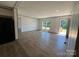 Bright living room featuring wood floors, neutral walls, and windows at 493 Eagle Mills Rd, Hamptonville, NC 27020