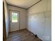 Bright room with wood-look flooring and a door leading to the outside at 493 Eagle Mills Rd, Hamptonville, NC 27020