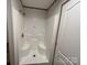 Shower stall featuring built in seats, sleek design, and white interior at 493 Eagle Mills Rd, Hamptonville, NC 27020