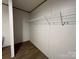 Walk-in closet with white wire shelving and neutral wall color at 493 Eagle Mills Rd, Hamptonville, NC 27020