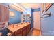 A bathroom with a double sink and warm lighting at 5003 Singletree Ln, Indian Trail, NC 28079
