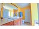 A bright bathroom with double sinks, and plenty of countertop space at 5003 Singletree Ln, Indian Trail, NC 28079