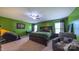 Bright bedroom boasts a king-size bed, ceiling fan, ample natural light, and workout space at 5003 Singletree Ln, Indian Trail, NC 28079