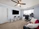 Comfortable bedroom featuring a ceiling fan, window, and versatile space for work or relaxation at 5003 Singletree Ln, Indian Trail, NC 28079