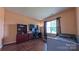 Bedroom featuring hardwood floors, a built-in bed frame, ample natural light, and a computer desk at 5003 Singletree Ln, Indian Trail, NC 28079