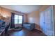 Bedroom featuring hardwood floors, a built-in bed frame, ample natural light, and desk area at 5003 Singletree Ln, Indian Trail, NC 28079