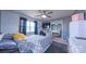 A bedroom with a modern ceiling fan, a TV, and a large window for natural light at 5003 Singletree Ln, Indian Trail, NC 28079