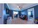 Bonus room with a ceiling fan, neutral carpet, and entertainment setup with additional seating at 5003 Singletree Ln, Indian Trail, NC 28079