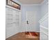 Entryway with a red and beige rug, a white closet and a white front door at 5003 Singletree Ln, Indian Trail, NC 28079