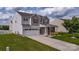 Attractive two-story home with a well-kept lawn and a spacious driveway at 5003 Singletree Ln, Indian Trail, NC 28079