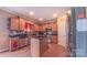 Cozy kitchen with ample storage, center island, and stainless steel appliances at 5003 Singletree Ln, Indian Trail, NC 28079