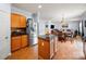 Open concept kitchen with stainless steel appliances, a center island, and breakfast area at 5003 Singletree Ln, Indian Trail, NC 28079