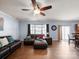 Relaxing living room with hardwood floors, a leather sofa, and a view of the outdoors at 5003 Singletree Ln, Indian Trail, NC 28079