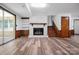 Spacious basement with fireplace, wood-look flooring, and natural light through sliding doors at 506 Richards Dr, Shelby, NC 28150