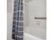 Bathroom showing bathtub, and a gray shower curtain at 506 Richards Dr, Shelby, NC 28150