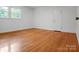 Bedroom featuring hardwood floors, white walls, and a door to the closet at 506 Richards Dr, Shelby, NC 28150