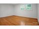 Bright bedroom with hardwood floors and natural light streaming through double windows at 506 Richards Dr, Shelby, NC 28150