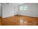 Bedroom featuring hardwood floors and a closet with folding doors at 506 Richards Dr, Shelby, NC 28150