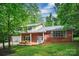 Lovely brick home featuring a two-car garage and mature trees, offering both comfort and natural beauty at 506 Richards Dr, Shelby, NC 28150