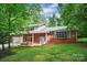 Beautiful brick home with large windows and a well-maintained front yard, creating a welcoming curb appeal at 506 Richards Dr, Shelby, NC 28150