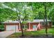 Inviting red brick home with well-manicured lawn and a two-car garage for added convenience at 506 Richards Dr, Shelby, NC 28150