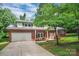 Charming two-story brick home with attached garage and lush green lawn, perfect for Gathering living at 506 Richards Dr, Shelby, NC 28150