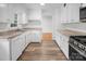 Bright kitchen features white cabinetry, granite countertops and stainless steel appliances at 506 Richards Dr, Shelby, NC 28150