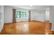 Spacious living room with hardwood floors, large windows, and an open layout, perfect for entertaining and Gathering gatherings at 506 Richards Dr, Shelby, NC 28150