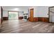 Spacious living room with hardwood floors and a fireplace with white painted bricks at 506 Richards Dr, Shelby, NC 28150
