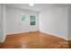 Living Room with wood floors, white walls and natural light from the window at 506 Richards Dr, Shelby, NC 28150