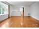 Open-concept living area with gleaming hardwood floors, offering plenty of natural light and space for relaxation at 506 Richards Dr, Shelby, NC 28150