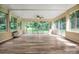 Bright sunroom with lots of windows that provide views of a lush backyard at 506 Richards Dr, Shelby, NC 28150