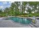 Manicured backyard with tall trees, landscaping, and pristine green lawn at 562 Preservation Dr, Fort Mill, SC 29715