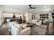 Wide angle view of living room and kitchen with modern decor and lots of open space at 562 Preservation Dr, Fort Mill, SC 29715