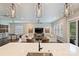 Bright living room with white sofas, plantation shutters, and modern lighting fixtures at 562 Preservation Dr, Fort Mill, SC 29715