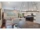 Open concept living room, dining, and kitchen area with plenty of light at 562 Preservation Dr, Fort Mill, SC 29715