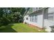 Side view of home highlighting the yard, shed, and architectural details at 607 Lee Ave, Wadesboro, NC 28170