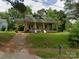 Charming, classic home with a covered front porch and mature trees in a desirable neighborhood at 607 Lee Ave, Wadesboro, NC 28170