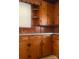 A vintage kitchen boasting wooden cabinets, classic countertops, and ample storage space at 610 E Maryland Ave, Bessemer City, NC 28016