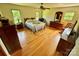 Bright bedroom featuring hardwood floors, ample natural light, and classic furnishings at 675 Godbey Rd, Salisbury, NC 28147