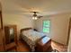 Cozy bedroom with hardwood floors, ceiling fan, and natural light at 675 Godbey Rd, Salisbury, NC 28147