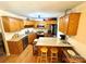 Well-lit kitchen features stainless steel appliances, center island, and wooden cabinets at 675 Godbey Rd, Salisbury, NC 28147