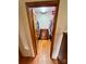 Spacious walk-in closet with hardwood floors and built-in shelving and drawer system at 675 Godbey Rd, Salisbury, NC 28147
