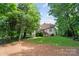 Expansive backyard featuring a deck and lush greenery, perfect for outdoor entertaining and relaxation at 6795 Montgomery Rd, Lake Wylie, SC 29710