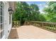 Wood deck with decorative flowers and peaceful wooded view at 6795 Montgomery Rd, Lake Wylie, SC 29710